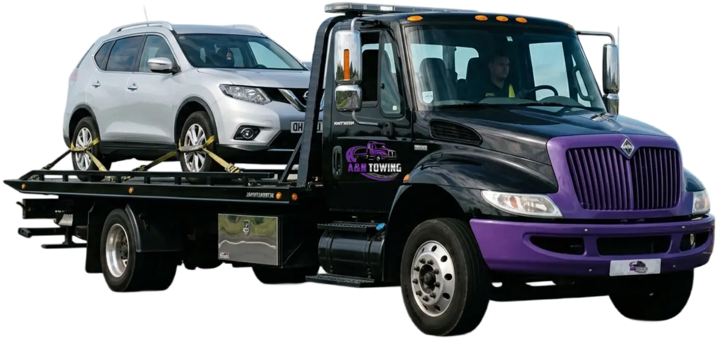 a_n_towing_truck_clear_bg_main A&N Towing flatbed truck loading a vehicle for 24/7 towing service in Chicagoland